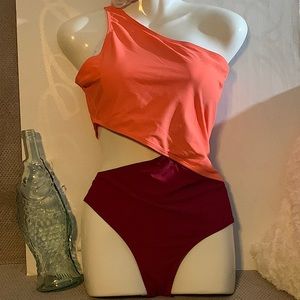 Two color One Piece swimsuit with side-out, one shoulder strap.